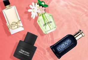 YSL, Marc Jacobs, Tom Ford and Hugo Boss products on a pink pool water background